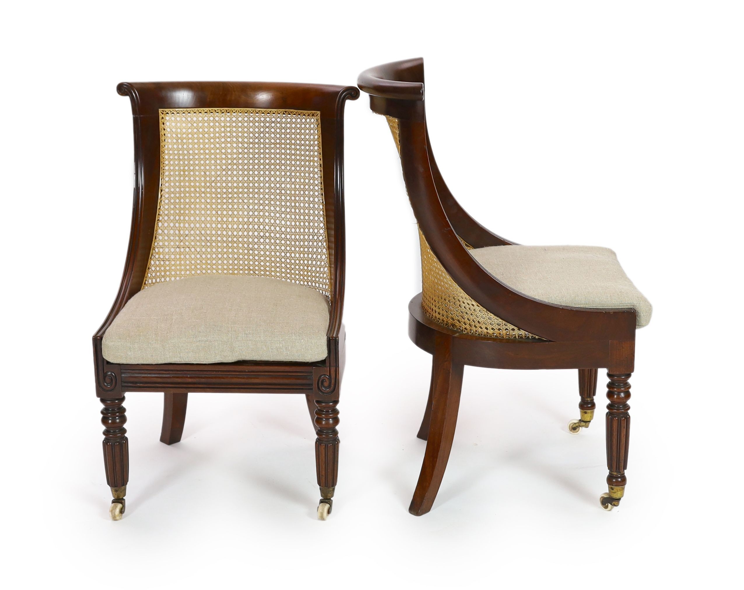 A pair of late Regency mahogany bergere side chairs